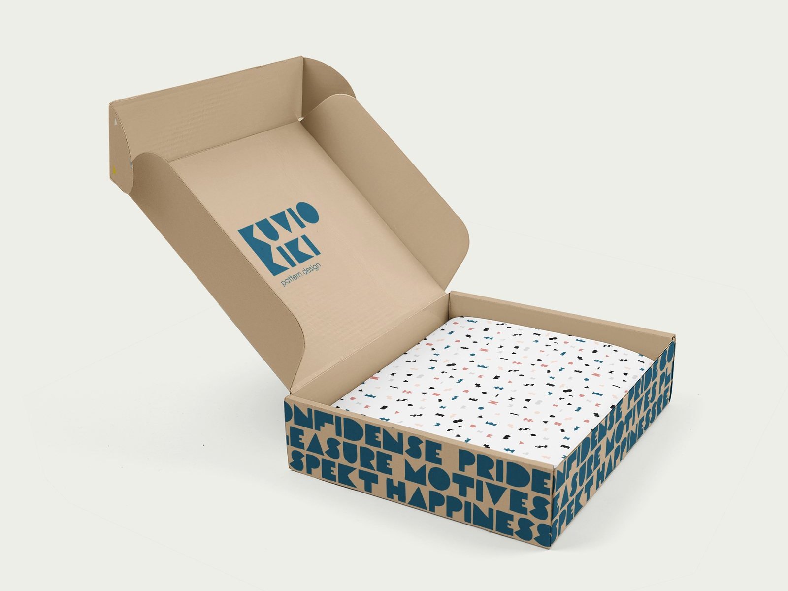 Open kraft box with the Kuvio Kiki logo and patterned tissue paper